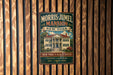 A vintage-style metal sign for the Morris-Jamel Mansion in New York, featuring an illustration of the mansion and text indicating its historical significance.