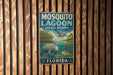 A vintage metal sign for Mosquito Lagoon Aquatic Preserve in Florida, featuring illustrations of various wildlife and plants.