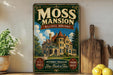 A vintage-style metal sign for the Moss mansion in Billings, Montana, featuring an illustration of a large, ornate mansion with a castle-like appearance.