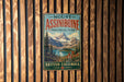 A vintage metal sign for Mount Assiniboine Provincial Park in British Columbia, Canada, featuring a scenic mountain landscape.