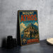 A vintage metal sign advertising Mount Athos in Greece, featuring a castle and a mountain landscape.