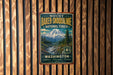 A vintage metal sign for Mount Baker-Snohomish National Forest in Washington, featuring a mountain landscape and the text "Explore - Discover - Protect".