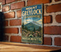 A vintage metal sign for Mount Greylock State Reserve in Massachusetts, featuring a scenic mountain landscape with pine trees and flowers.