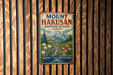 A vintage metal sign with the text "Mount Hakusan" and "Biosphere Reserve Japan" is displayed on a wooden wall.