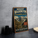 A vintage metal sign advertising Mount Washington via Tuckerman Ravine Trail, with a mountain landscape and trail sign.