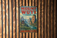A vintage metal sign with the text "MOUNT WUYI CHINA" and an illustration of a mountainous landscape with a temple in the background.