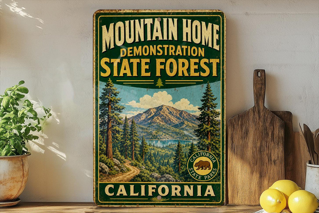 a vintage-style sign for the Mountain Home State Forest in California, with a scenic mountain landscape and pine trees.