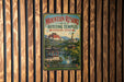 A vintage-style sign for the Mountain Resort and its Outlying Temples in Chengde, China, featuring a scenic image of traditional Chinese architecture and a temple surrounded by a river.