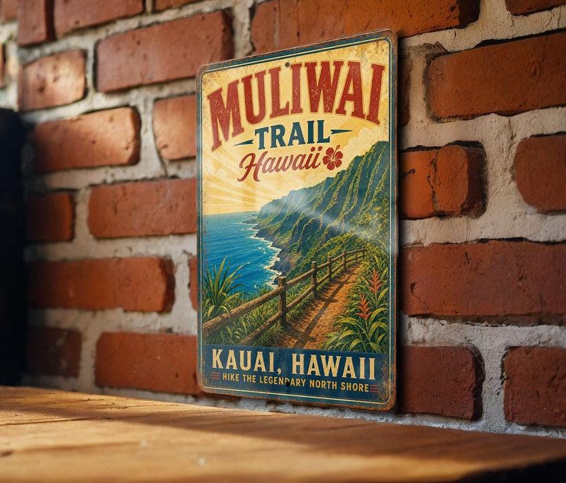 A vintage-style metal sign with the text "Muliwai Trail Hawaii" and "Kauai, Hawaii" printed on it, hanging on a brick wall.