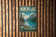 A vintage metal sign for Muncho Lake, a scenic Canadian wilderness park, is displayed on a wooden wall.