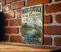 A vintage-style metal sign for the Muscatuck National Wildlife Refuge in Indiana, featuring an illustration of a bird and a serene landscape.