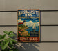A vintage-style metal sign for Narragansett Bay, Rhode Island, featuring a lighthouse, sailboats, and a scenic landscape.