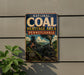 a vintage-style metal sign with the text "National Coal Heritage Area Pennsylvania" and an illustration of a steam locomotive on a track.