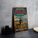 A vintage-style metal sign for the National Elk Refuge in Wyoming, featuring an illustration of a majestic elk standing in a scenic landscape.