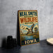 A vintage-style metal sign for the Neal Smith National Wildlife Refuge in Iowa, featuring an illustration of ducks and a birdhouse.