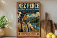 A vintage-style metal sign with the name "NEZ PERCE" and the text "NATIONAL HISTORICAL PARK IDAHO" displayed prominently. The sign also features an illustration of a Native American woman in traditional clothing, with a scenic landscape in the background.