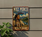 a vintage-style metal sign with a Native American woman in traditional clothing, set against a backdrop of mountains and a river.