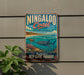 A vintage-style metal sign for the Ningaloo Coast in Western Australia, featuring an illustration of a whale, coral, and other marine life.