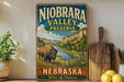 a vintage-style sign for Niobrara Valley Preserve in Nebraska, with a buffalo illustration and a scenic landscape.