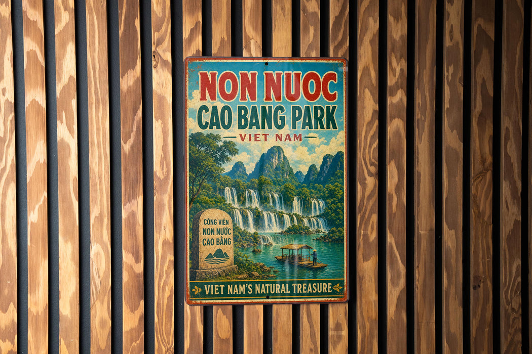 a vintage-style sign for Non Nuc Cao Bang Park, Vietnam, with a waterfall and boats in the background.
