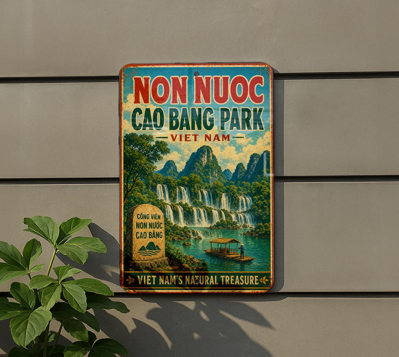 a vintage-style sign for the Non nuoc Cao Bang Park in Vietnam, with a scenic landscape of waterfalls and mountains in the background.