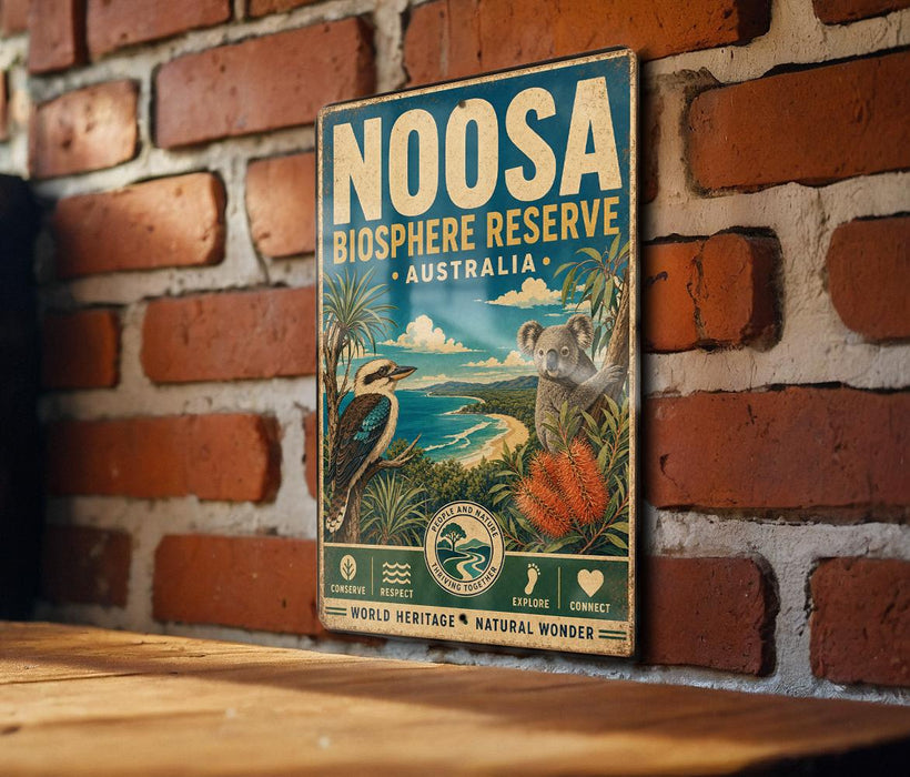 a vintage-style sign for the Noosa Bioscape Reserve in Australia, mounted on a brick wall.