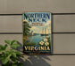 A vintage-style sign for the Northern Neck National Heritage Area in Virginia, featuring a sailboat, a lighthouse, and a bird.