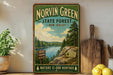 A vintage-style sign for Norvin Green State Forest in New Jersey, featuring a scenic landscape with a river, pine trees, and hiking trails.