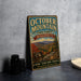 A vintage metal sign for October Mountain State Forest in Massachusetts, featuring a scenic mountain landscape and the text "Explore, Protect, Enjoy" in a rustic style.