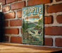 A vintage-style metal sign for Ohio Park, Pennsylvania, featuring a scenic illustration of a waterfall and a bridge.