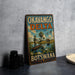 A vintage-style metal sign for Okavango Delta, Botswana, featuring an illustration of a man fishing in a boat surrounded by wildlife.
