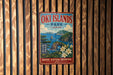 A vintage-style metal sign for Oki Islands Park in Japan, featuring a scenic landscape with mountains, water, and flowers.