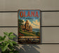 A vintage-style metal sign for the Olana State Historic Site in New York, featuring an illustration of a historic building surrounded by trees and a river.