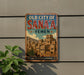 a vintage-style sign for the "Old City of Sana'a Yemen" mounted on a wall.