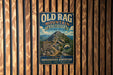 a vintage-style metal sign for the Old Rag Mountain Circuit in Virginia, mounted on a wooden wall.