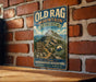 A vintage-style metal sign for the Old Rag Mountain Circuit in Virginia, featuring a mountain landscape and trail directions.