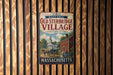a vintage metal sign for Old Sturbridge Village, with a picture of a horse-drawn carriage and a church.