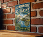 A vintage-style sign for the Old Woman Creek National Estuarine Research Reserve in Ohio, featuring a heron and a house in the background.