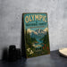 A vintage-style metal sign for the Olympic National Forest in Washington, featuring a mountain landscape and the text "Olympic National Forest Washington" prominently displayed.
