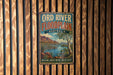 A vintage-style metal sign for the Ord River Floodplain in Australia, featuring a scenic landscape with mountains, water, and vegetation.