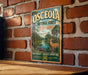 A vintage metal sign for the Osceola National Forest in Florida, featuring a scenic illustration of a deer and a river surrounded by palm trees.