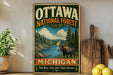 A vintage-style metal sign for the Ottawa National Forest in Michigan, featuring a moose and a scenic landscape.