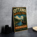 A vintage metal sign for the Ottawa National Forest in Michigan, featuring a moose and a forest landscape.