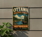 A vintage metal sign for the Ottawa National Forest in Michigan, featuring a moose and a scenic landscape.