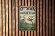 A vintage metal sign for the Ottawa National Wildlife Refuge in Ohio, featuring illustrations of birds and a river.