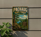 A vintage metal sign for the Pachaug State Forest in Connecticut, featuring a scenic landscape with pine trees, a lake, and mountains.