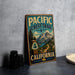 A vintage-style metal sign for the Pacific Crest Trail in California, featuring a scenic mountain landscape and a trail marker.