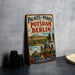 A vintage metal sign advertising "Palaces and Parks of Potsdam and Berlin" in Germany, featuring an illustration of the city's landmarks and architecture.