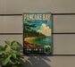 A vintage-style sign for Pancake Bay Provincial Park in Ontario, featuring a scenic landscape with a beach, pine trees, and a lake.