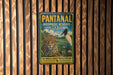 A vintage metal sign for the Pantanal Biosphere Reserve in Brazil, featuring an illustration of a jaguar and a bird in a tropical landscape.